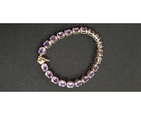 9CT YELLOW GOLD AMETHYST LINE BRACELET