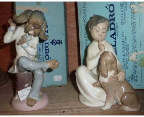 Lladro figurine depicting young boy with dog and Lladro figurine (with original boxes)