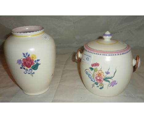 Poole pottery vase and a Poole pottery lidded jar with wicker handle