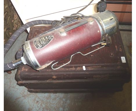 Tin trunk and a vintage Phoenix Major vacuum cleaner