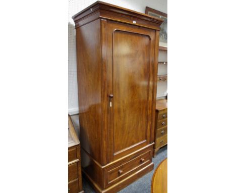 A mahogany hall robe, ogee cornice, panel door, plinth base.