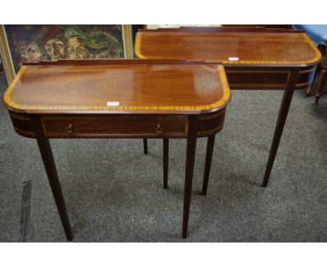 A pair of reproduction mahogany hall tables, shaped gallery, crossbanded top, rounded angles, single drawer to frieze, axe he