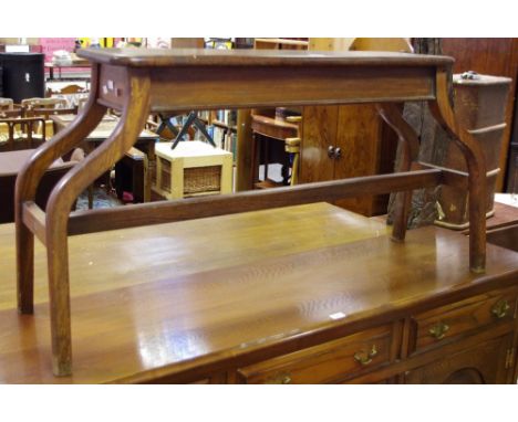 An unusual pitch pine organ bench&nbsp;with bowed legs and refectory stretcher