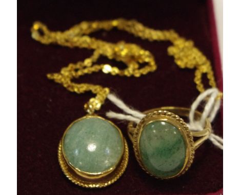 A 9ct gold pendant and ring suite, each set with a green stone oval cabochon, possibly jade, 9ct gold frame and mount, 8.2g g