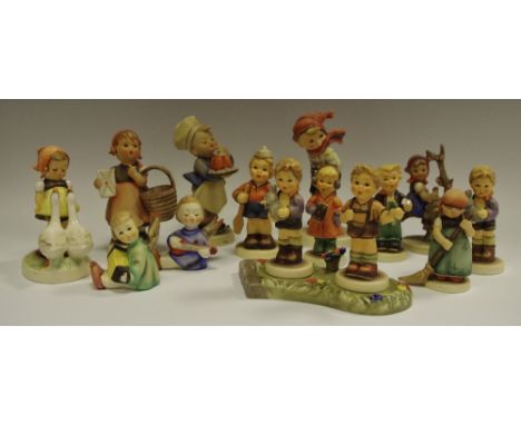 M.I. Hummel figures including Goose Girl, March Winds, Meditation, Apple Tree Girl, Little Sweeper, Angel with Lute, Angel wi