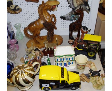 A Sherratt &amp; Simpson model of cat lapping up spilt milk; others; a large wooden carving of a wild horse; a Ringtons Tea M