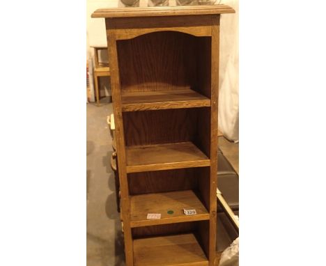 Heavy oak nine shelf narrow CD/DVD stand, H: 180 cm. Not available for in-house P&amp;P, contact Paul O'Hea at Mailboxes on 0