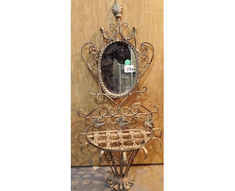 Wrought iron mirror with attached under shelf, H: 90 cm. Not available for in-house P&amp;P, contact Paul O'Hea at Mailboxes 