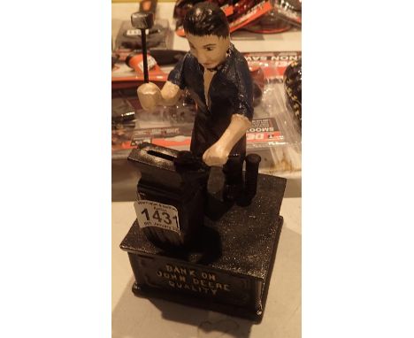 Cast Iron John Deere blacksmith interactive money box, H: 25 cm. P&amp;P Group 2 (£18+VAT for the first lot and £3+VAT for su