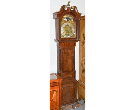 A George III oak and mahogany eight-day longcase clock with brass arch top dial, silvered chapter ring, moon roller and two s