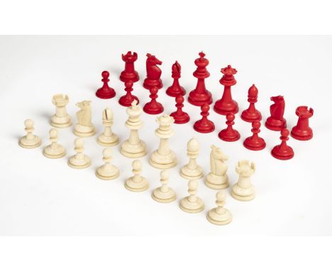 * Chess set. An Edwardian ivory chess set, probably carved in India, with 16 pieces stained in red and 16 left natural, some 