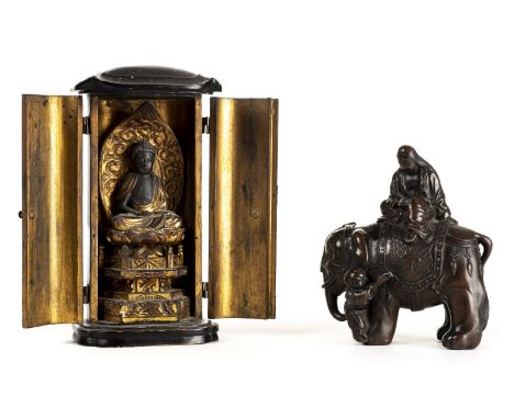 Chinese figural group. A Chinese bronzed metal figural group circa 1900, modelled as an elephant surmounted by a scholar with