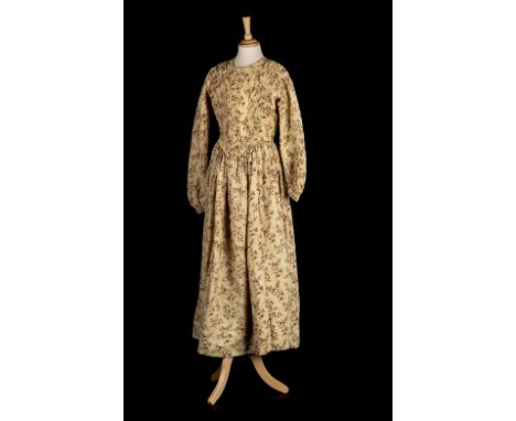 * Dress. A printed cotton day dress, circa 1840s, pink and green floral pattern on a mottled dark cream and white ground, lin