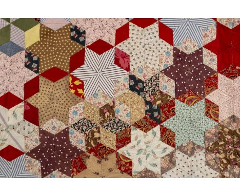* Quilts. A patchwork quilt by Mrs. Twine, Sussex, early 20th century, a hand-stitched patchwork bedcover, with all-over star