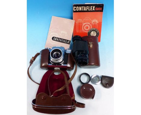 A Zeiss Contaflex 35mm SLR camera  with 2.8 45mm lens and rotating effects filter with 80 x 30 monocular lens, instruction ma