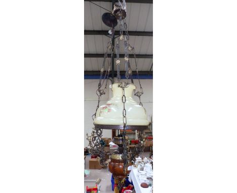 An antique style central light fitting with shade and funnel