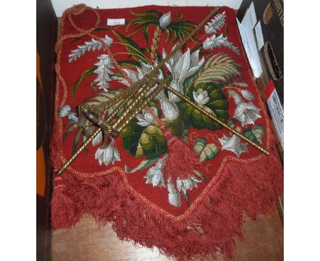 A Victorian gilt metal folding screen bracket with beadwork fabric panel, red ground