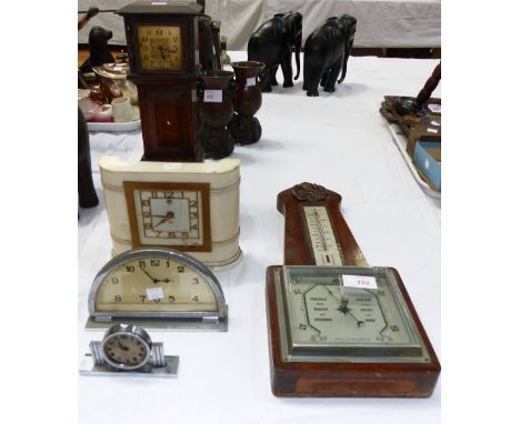 A 1930's aneroid barometer; an early 20th century miniature longcase clock; 3 vintage clocks