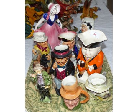 A selection of Toby jugs; an Art Deco figure (chip to base) etc