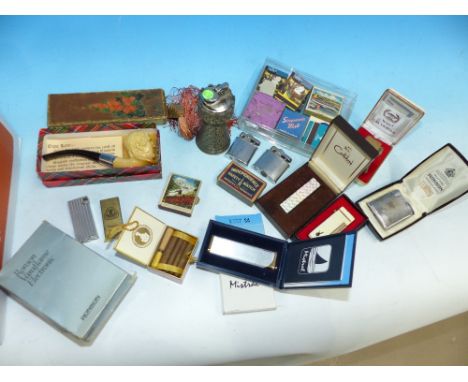A selection of vintage cigarette lighters; matches; etc.
