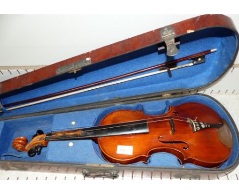 A Stradivarius pattern violin and bow, veneered wood case, 14" 2 piece back