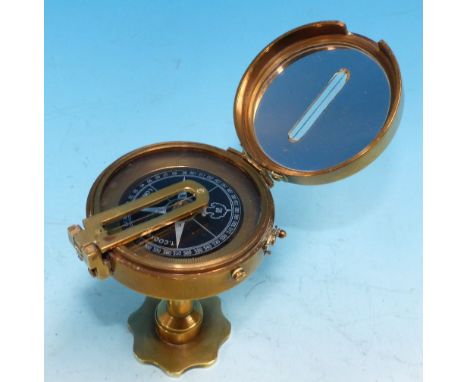 A brass pedestal compass with sighting device, impressed:  T. Cook, London 8-5-1919