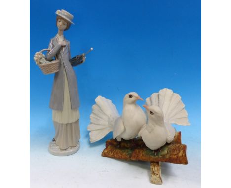 A Nao figure:  woman with parasol, height 15½"; a bisque group of 2 doves