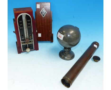 An oriental pewter globe tea caddy; a metronome; a telescope; a till