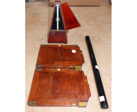 A mahogany cased metronome by John Church, dated 1899 (restored); 2 brass and mahogany half size plate holders; an ebony cyli