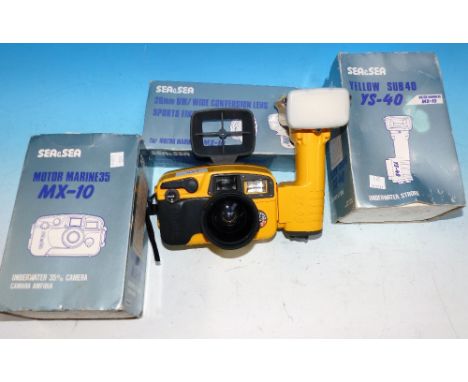 A Sea & Sea diving camera with 20mm conversion lens and flash unit. boxes