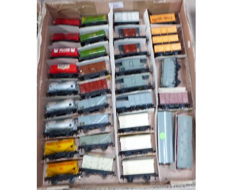 Thirty-five Hornby Dublo vintage trucks and wagons, including 12 tank wagons, goods brake vans; etc.