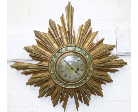 A 1930's wall clock in sunburst frame (a.f.)