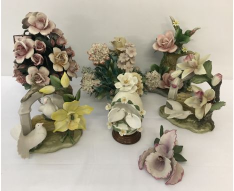 A box of capodimonte ceramic floral spray ornaments in matte finish.  
