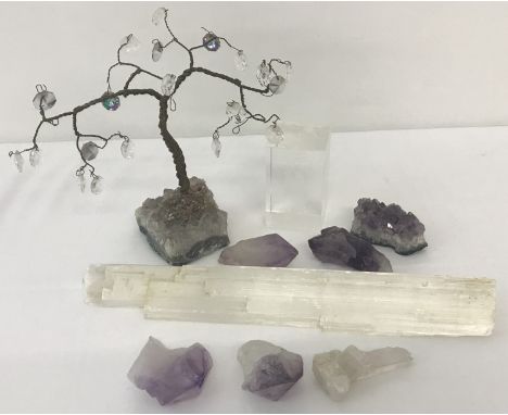 A wire bonsai tree with hanging crystals and a  natural amethyst crystal base. Together with 5 pieces of amethyst crystals, a