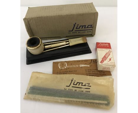 A Jima Meerschaum pipe, Pipe of the Year 2000. Together with a boxed set of Jima helical filters. 