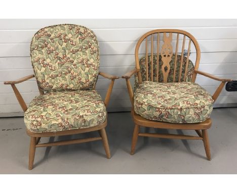 A pair of retro light wood Ercol style low easy chairs.  With spindle backs. 