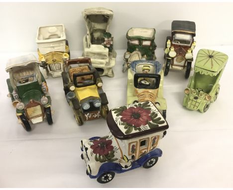 A collection of 9 ornamental ceramic vintage car figurines.  In an assortment of colours, makes and sizes. 