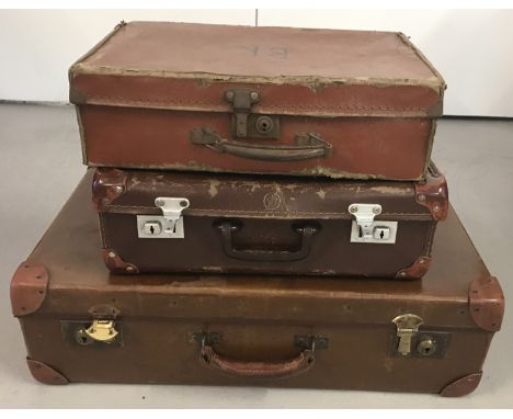3 vintage brown leather effect suitcases.   Largest approx. 61cm x 39cm.