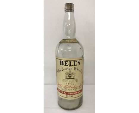 A large vintage Bells Scotch Whisky 4.5 litre bottle.   Approx. 50cm tall.