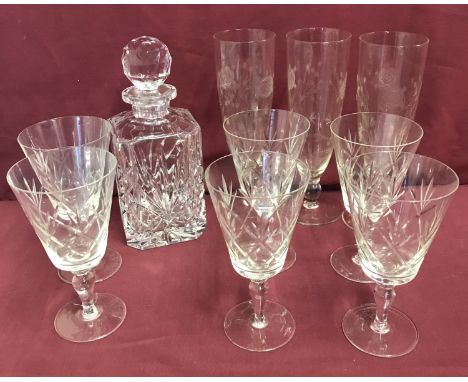 A cut glass decanter together with 6 large wine glasses and 3 etched vases.  