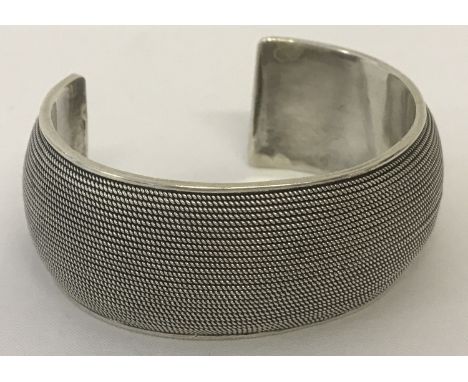 A heavy contemporary design cuff bangle.  Marked 925 to inside.  Total weight approx. 66g.