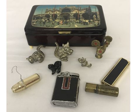 A small vintage tourist musical box.  Together with a small collection of metal animals and vintage lighters to include a Par