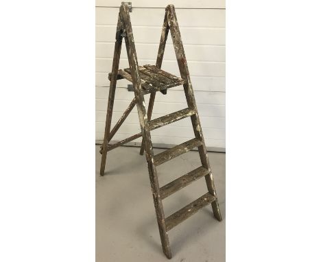 A set of vintage wooden 4 rung folding steps.   Size approx. 129cm unfolded.