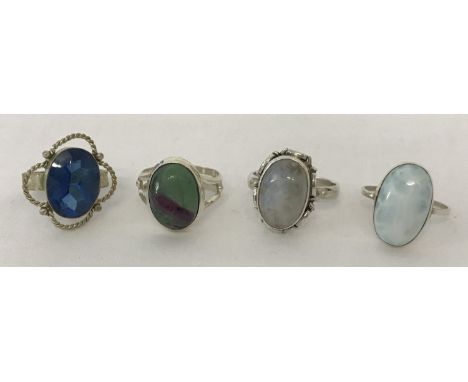 4 silver ladies dress rings.  Comprising; oval cut blue stone, oval cut amazonite, oval cut labradorite and oval cut ruby wit