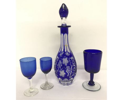 A Royal blue Bohemia cut glass decanter with 3 blue glass louve glasses.  