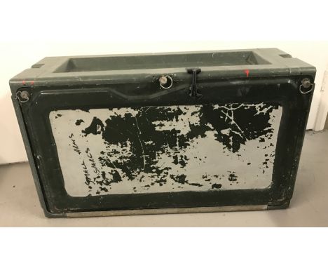 A green fibreglass and tin military trunk.   Approx. 89cm x 51cm x 33cm.