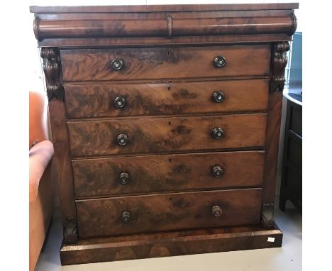 A Victorian mahogany veneer 6 drawer scotch chest with carved detail to sides.  Pearl inlay detail to handles.  Approx. 139cm