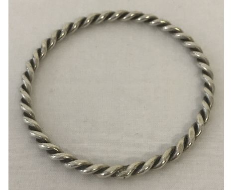 A silver twist design bangle.   Total weight approx. 20.5g.