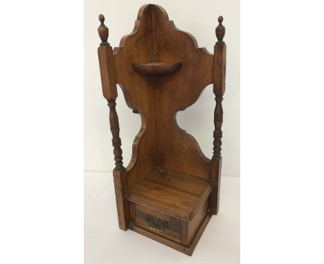 A vintage satin wood corner shelf with single drawer.  Turned columns with finial detail to top. Drawer has drop down handle.