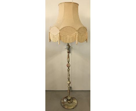 A vintage green and brown onyx standard lamp.  With cream tasselled lampshade. 